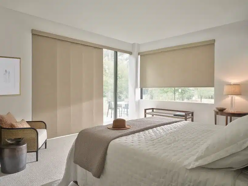 Roller shades darkening a Centreville bedroom